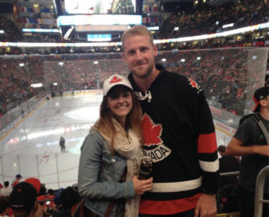 Kiel Matisz with his wife at a hockey game