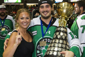 Corey Small and his wife celebrate after winning the Mann Cup